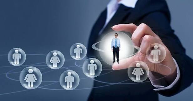 Recruitment specialist reviewing job applications and candidate profiles